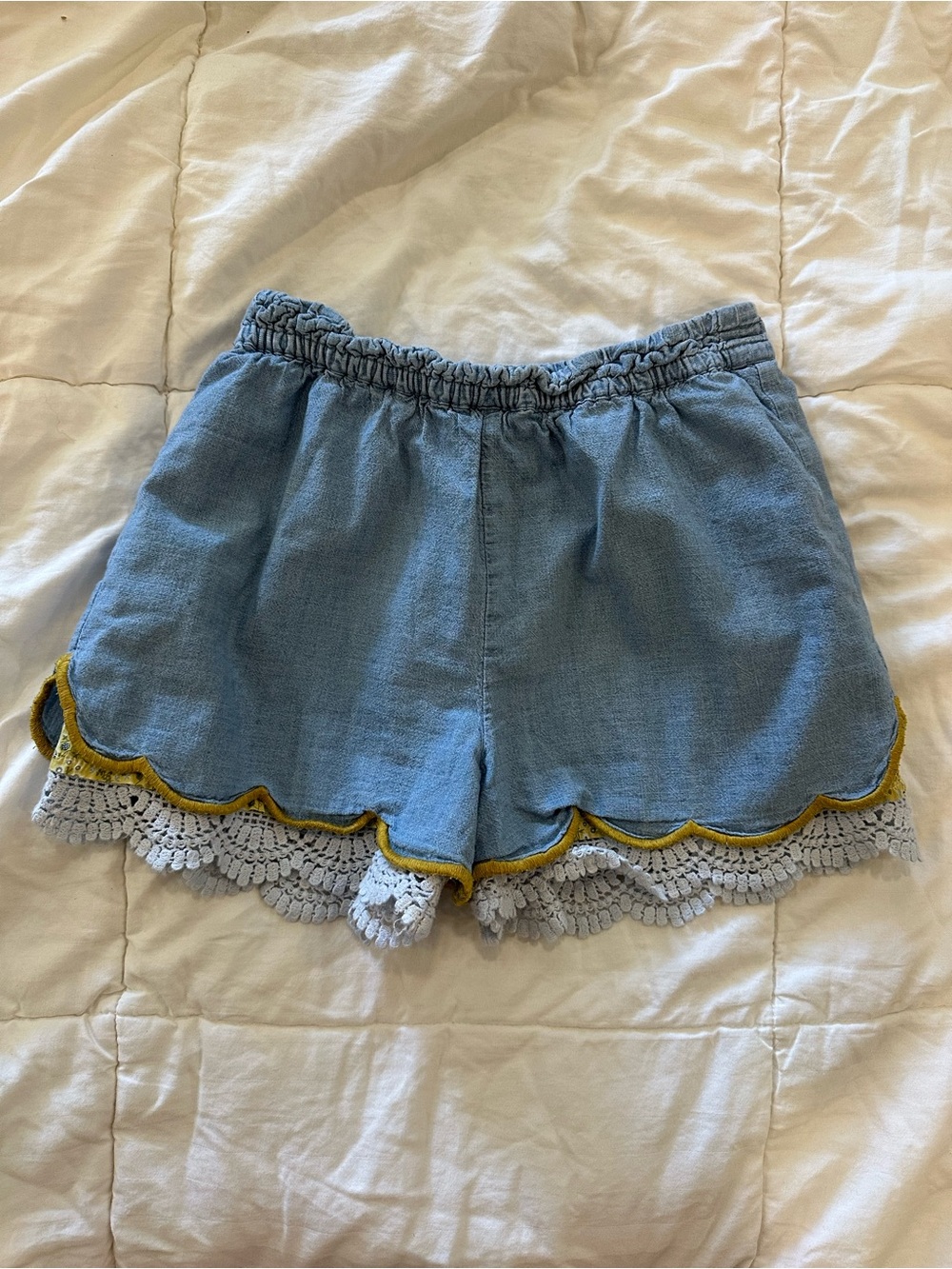 Denim shorts with lace trim